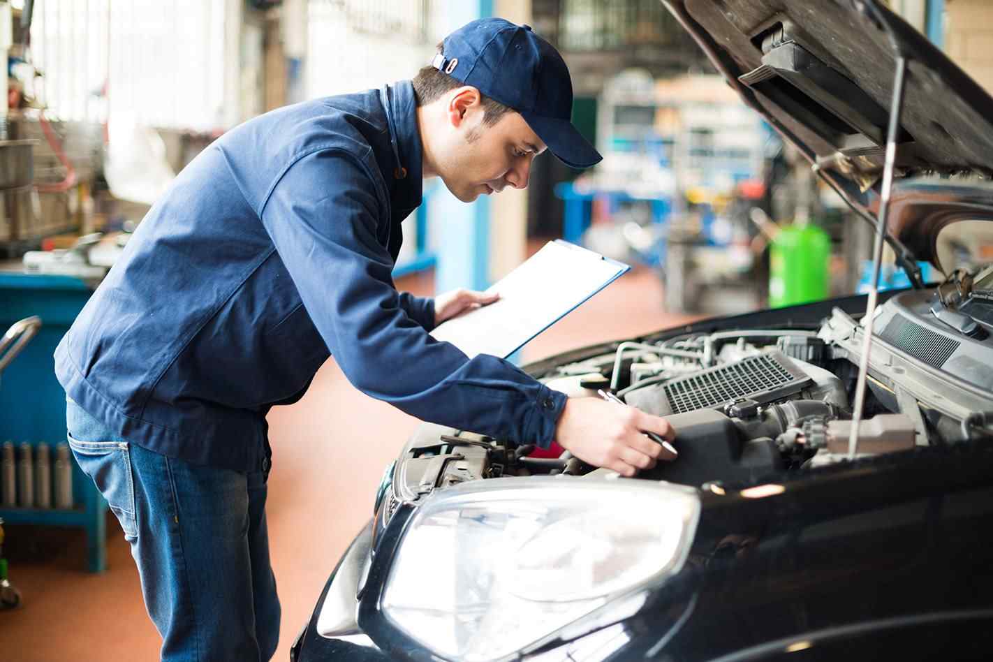 mechanic servicing vehicle